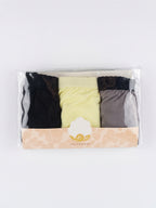 A three-pack of women's underwear in a clear plastic clamshell package with a beige paper band. The pack contains a cream-colored pair, a dark navy pair, and a light blue pair, with a central white label showing a gold logo and the word 'UNISEX'.