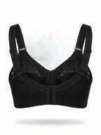 A black wireless underwire bra with adjustable shoulder straps, a center gore, and sheer lace cups, displayed against a white background.