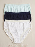 A three-pack of women's underwear in a clear plastic clamshell package with a beige paper band. The pack contains a cream-colored pair, a dark navy pair, and a light blue pair, with a central white label showing a gold logo and the word 'UNISEX'.