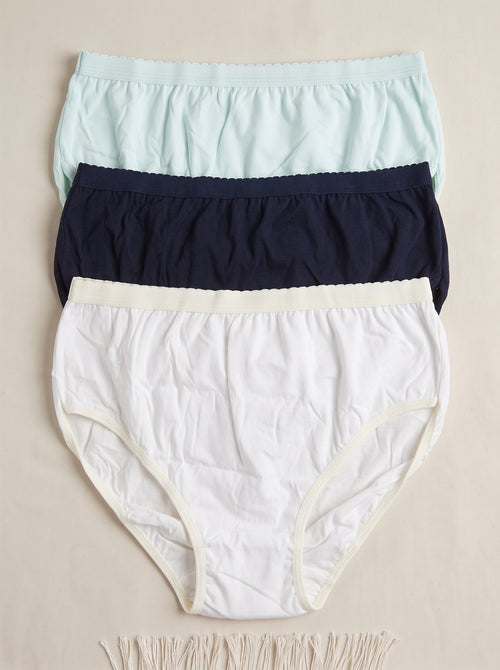 A three-pack of women's underwear in a clear plastic clamshell package with a beige paper band. The pack contains a cream-colored pair, a dark navy pair, and a light blue pair, with a central white label showing a gold logo and the word 'UNISEX'.